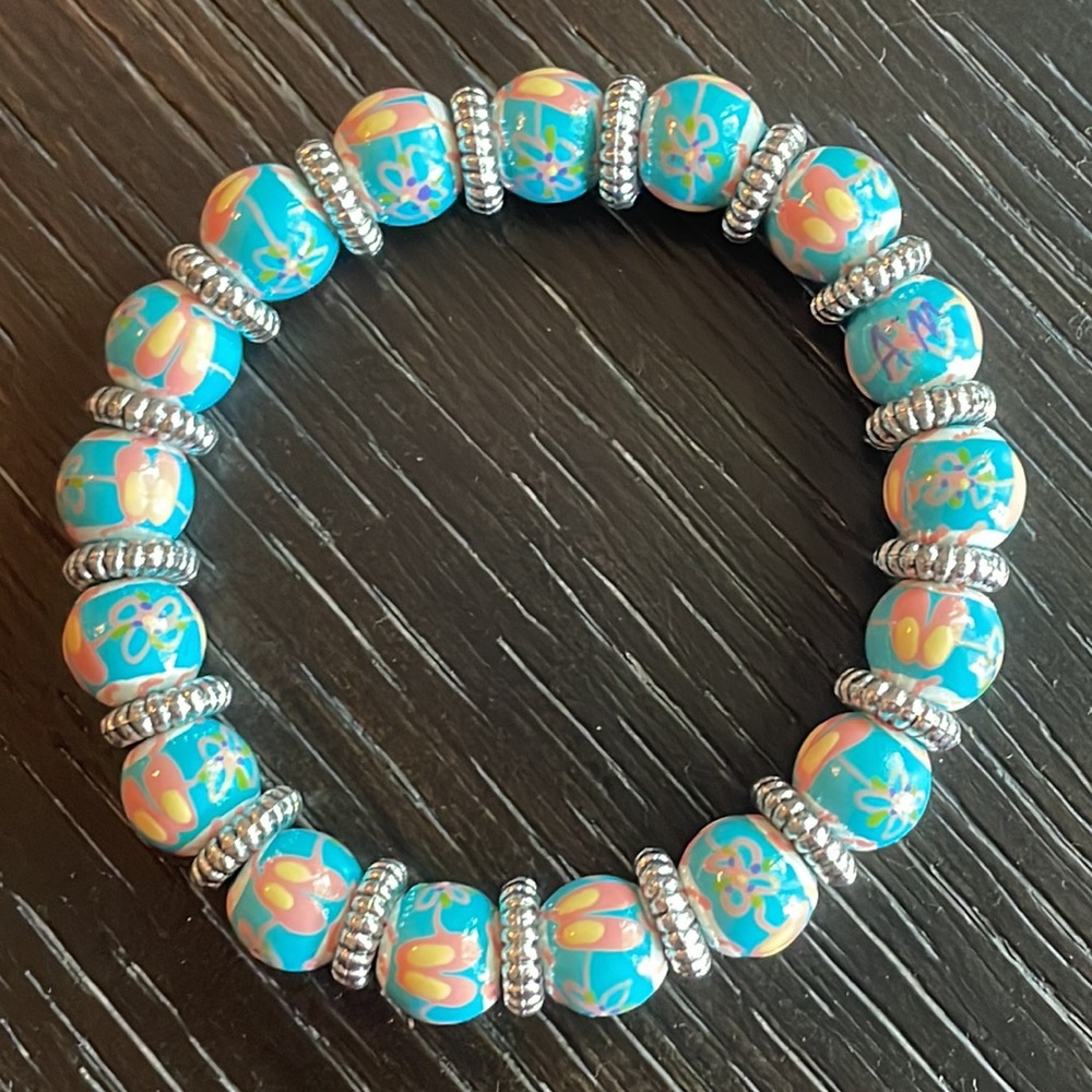 Hand painted Angela Moore bracelet with ballet slipper theme beads.